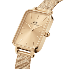 Quadro Pressed Unitone Gold watch featuring a rectangular gold dial, minimalist hour markers, and a pressed gold mesh strap with a polished stainless steel case.