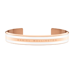 Minimalist rose gold cuff bracelet with satin white enamel detailing, featuring the Daniel Wellington logo engraved on the front.