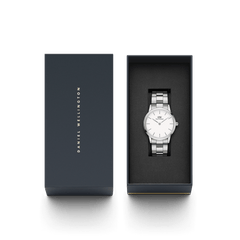 The Iconic Link Silver watch is presented in a sleek Daniel Wellington gift box, showcasing its polished stainless steel bracelet and minimalist eggshell white dial.