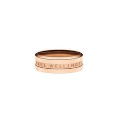 Minimalist rose gold ring with a slim band and engraved Daniel Wellington logo, featuring a polished finish and modern, unisex design.