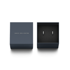 Elan Earrings Silver presented in an elegant Daniel Wellington gift box, featuring a pair of minimalist silver huggie earrings with engraved branding, ideal for gifting or adding to a jewellery collection.