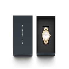 Iconic Link Gold watch with a gold stainless steel bracelet and minimalist white dial, elegantly presented in a black Daniel Wellington gift box.