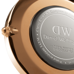 Back view of the Classic Winchester Rose Gold watch showing the engraved stainless steel caseback with water resistance details and serial number, framed by the polished rose gold finish.
