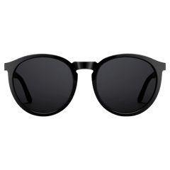 Arch Bio-Acetate Black sunglasses with a minimalist round frame and deep black lenses, featuring lightweight bio-acetate construction and subtle Daniel Wellington branding on the temples.
