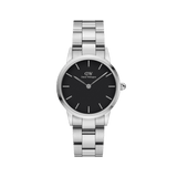 Iconic Link by Daniel Wellington featuring a polished stainless steel link bracelet, understated black dial, and minimalist silver hour markers, suitable for both men and women seeking a versatile everyday watch.