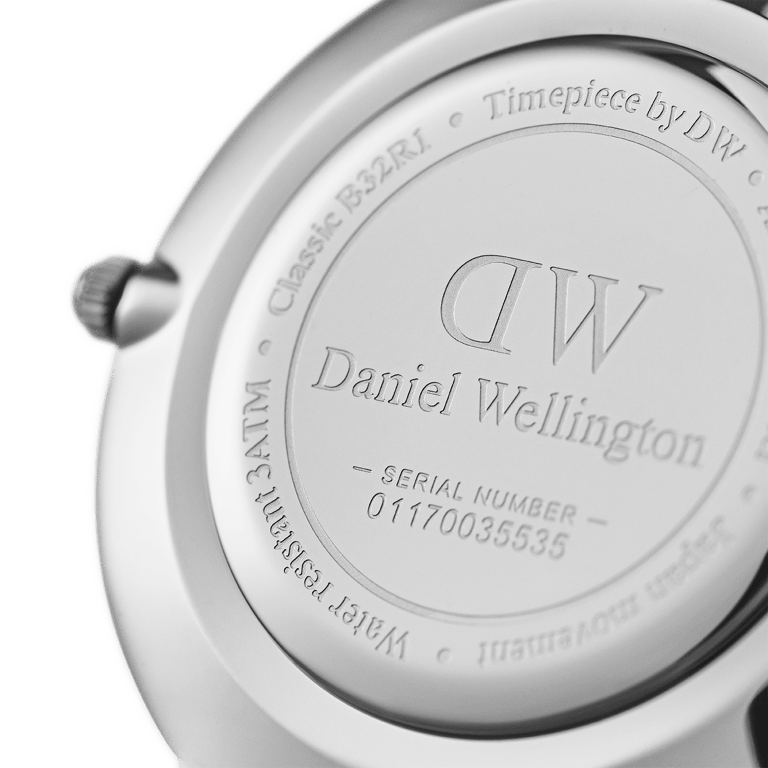Back view of the Petite Cornwall Black Silver watch showing the engraved stainless steel case back with Daniel Wellington branding, water resistance rating, and unique serial number.