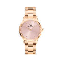 Ladies rose gold wristwatch with a soft pink sunray dial and minimalist hour markers, featuring a polished adjustable link bracelet suitable for everyday wear.