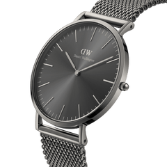 Classic Mesh Graphite watch with a graphite sunray dial, slim silver case, and a graphite grey stainless steel mesh strap, shown from an angled side view to highlight its minimalist design and textured bracelet.