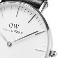 Close-up of the Classic Southampton Silver watch showing the eggshell white dial, slim silver hands and markers, and a polished silver case with a black leather strap. The minimalist design highlights the refined details and quality craftsmanship.