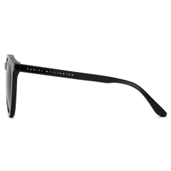 Side view of Arch Bio-Acetate Black sunglasses showing the sleek black acetate frame and Daniel Wellington branding on the temple.