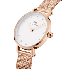 Close-up of the Petite Lumine Pressed Melrose ladies watch showing the rose gold pressed mesh strap, slim case, minimalist white dial, and sparkling crystal hour markers.