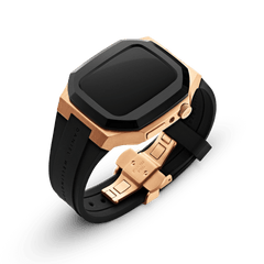 Switch Rose Gold Apple Watch case in brushed rose gold stainless steel with a bold black bezel, featuring a black FKM rubber strap and a secure deployment clasp, shown at an angle to highlight its ergonomic design and premium finish.