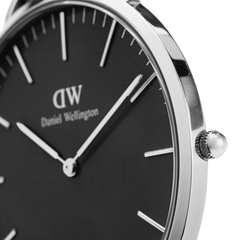Side angle of the Classic Cornwall Black Silver watch showing the polished stainless steel case, black dial, and minimalist silver hour markers and hands.