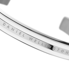 Detail view of the Emalie Bracelet Silver highlighting the engraved Daniel Wellington branding, polished silver finish, and satin white enamel accent.