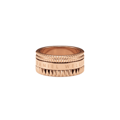 Elevation Ring Rose Gold featuring a wide, polished rose gold band with geometric textured edges and the Daniel Wellington logo engraved around the centre.