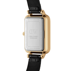 The back of the Quadro Pressed Ashfield Gold watch reveals a stainless steel case with engraved details, gold-plated sides, and a black adjustable mesh strap, highlighting its premium craftsmanship and water-resistant feature.