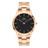 Daniel Wellington Iconic Link Black Rose Gold wristwatch with a sleek black dial, minimalist rose gold hour markers, and a polished rose gold stainless steel bracelet strap.
