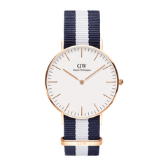 Classic Glasgow Rose Gold watch featuring a slim rose gold case, minimalist eggshell white dial, and a blue and white striped NATO strap for a modern nautical look.