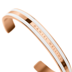 Detail view of the Emalie Bracelet Satin White Rose Gold, showing the satin white enamel and rose gold plating with Daniel Wellington branding on the cuff.