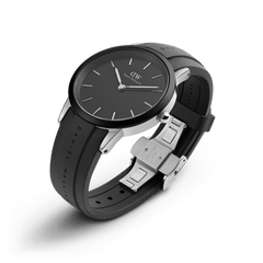 Iconic Motion Silver watch by Daniel Wellington with a minimalist black dial, silver stainless steel case, and a robust black FKM rubber strap featuring an adjustable clasp, ideal for both active and professional settings.