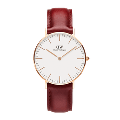 Classic Suffolk Rose Gold watch with a slim rose gold case, minimalist eggshell white dial, and a rustic red genuine leather strap, designed for versatile everyday wear.