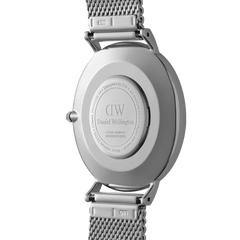 Back view of the Classic Mesh Onyx watch showing the engraved Daniel Wellington caseback, stainless steel mesh strap, and secure clasp, highlighting the quality craftsmanship and attention to detail.