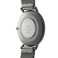 Back view of the Classic Mesh Arctic Silver watch showing the engraved stainless steel case, serial number, and bright silver mesh strap with secure connectors.
