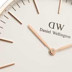 Close-up of the Classic Glasgow Rose Gold watch face, highlighting the minimalist eggshell white dial, slim rose gold hands, and elegant hour markers.