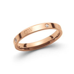 Classic Lumine Ring Rose Gold features a slim rose gold band with polished surface, alternating crystal stones and logo etchings, offering understated elegance suitable for everyday wear or gifting.