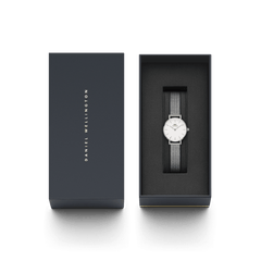 Petite Pressed Sterling ladies watch with a silver mesh strap and white dial, elegantly presented in a branded Daniel Wellington gift box, perfect for gifting or adding to your collection.