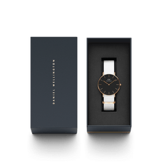 Classic Dover Black Rose Gold watch with a black dial and white NATO strap, elegantly presented in a branded Daniel Wellington gift box, ideal for gifting or personal use.