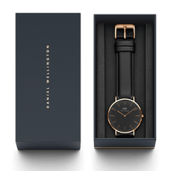 Classic Sheffield Black Rose Gold men’s watch with a black dial and black leather strap, presented in an elegant Daniel Wellington gift box.