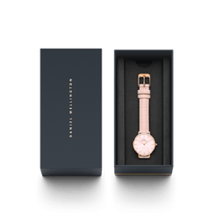 Petite Rouge Pink MoP Rose Gold ladies watch with a pink croc-pattern leather strap and rose gold case, elegantly presented in a branded Daniel Wellington gift box.