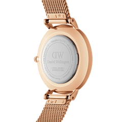 Rear view of the Petite Amber Rose Gold ladies watch showing the engraved Daniel Wellington case back, rose gold stainless steel case, and adjustable mesh strap.