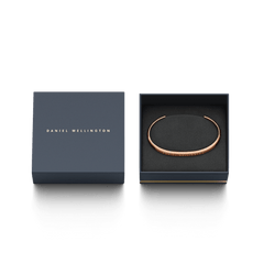 Classic Bracelet Rose Gold by Daniel Wellington presented in a sleek branded gift box, featuring a slim, minimalist rose gold cuff design.
