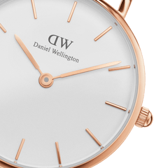 Detail view of the Petite Suffolk Rose Gold ladies watch showing the rose gold coated stainless steel case, minimalist white dial, and slim rose gold hour markers and hands.