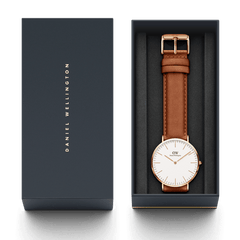 Classic Durham Rose Gold watch presented in a sleek Daniel Wellington gift box, featuring a light brown leather strap and minimalist white dial for a timeless gifting option.