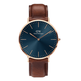 Classic St Mawes Arctic Rose Gold watch featuring a deep blue minimalist dial, rose gold round case, slim line markers, and a brown Italian Nappa leather strap with a polished rose gold buckle.
