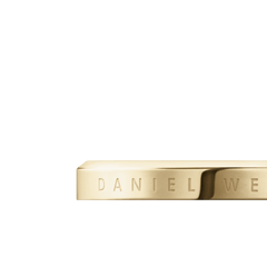 Close-up of the Classic Ring Gold showing the engraved Daniel Wellington branding on a polished, slim gold band with a smooth finish.