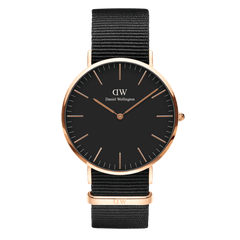 Classic Cornwall Black Rose Gold watch featuring a minimalist black dial, slim rose gold stainless steel case, and an adjustable black NATO style polyester strap.