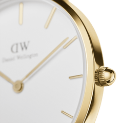 Close-up of the Petite St Mawes Gold watch showing its polished gold-plated case, minimalist white dial, and slim gold hour markers for a refined, elegant look.