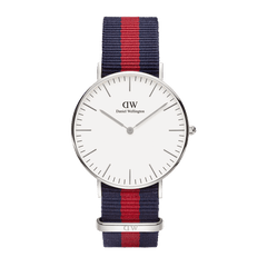 Classic Oxford Silver watch with a minimalist white dial, slim silver hour markers, and a blue and red NATO style polyester strap, featuring a polished silver case and adjustable fit.