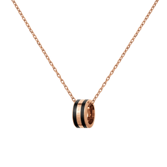 Rose gold chain necklace featuring a circular black enamel pendant with engraved detailing, showcasing a minimalist and modern design suitable for everyday wear or layering with other jewellery.