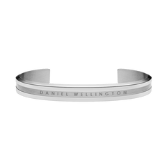 Minimalist silver cuff bracelet with a polished finish, featuring the engraved Daniel Wellington logo and a slim, open design suitable for both men and women.