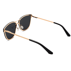 Ambler Steel Rose Gold sunglasses with a softly rounded rose gold plated stainless steel frame, dark nylon lenses, and black cellulose acetate temple tips, shown from an angled rear view to highlight the adjustable silicone nose pads and slim arms.