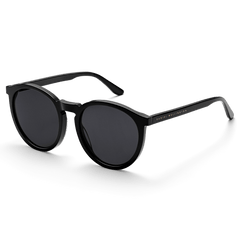 Arch Bio-Acetate Black sunglasses featuring a sleek round black frame, deep black lenses, and Daniel Wellington branding on the temple, designed for comfort and everyday UV protection.