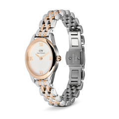 Daniel Wellington Ophelia Mini Two Tone Rose Gold watch with a slim oval case, white dial, rose gold Roman numerals, and a polished rose gold and silver five-link stainless steel bracelet with an open butterfly clasp.