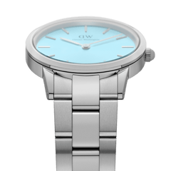 Side view of the Iconic Link Capri women’s watch, highlighting the brushed stainless steel bracelet and the pastel blue dial with minimalist detailing.