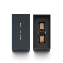 Petite Melrose Black Rose Gold watch with a black dial and rose gold mesh strap presented in a sleek Daniel Wellington gift box, ideal for gifting or adding to your collection.
