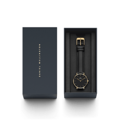 Petite Sheffield Black Gold ladies watch with a black dial, slim gold markers, and genuine leather strap, elegantly presented in a branded gift box.